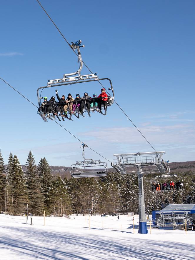 eight person chairlift with people