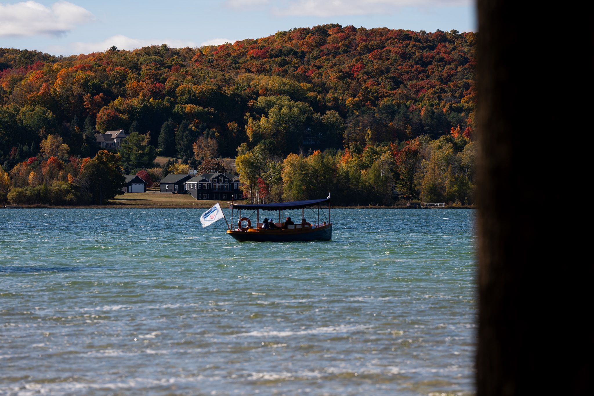 Boat cruise along deer lake with fall colors