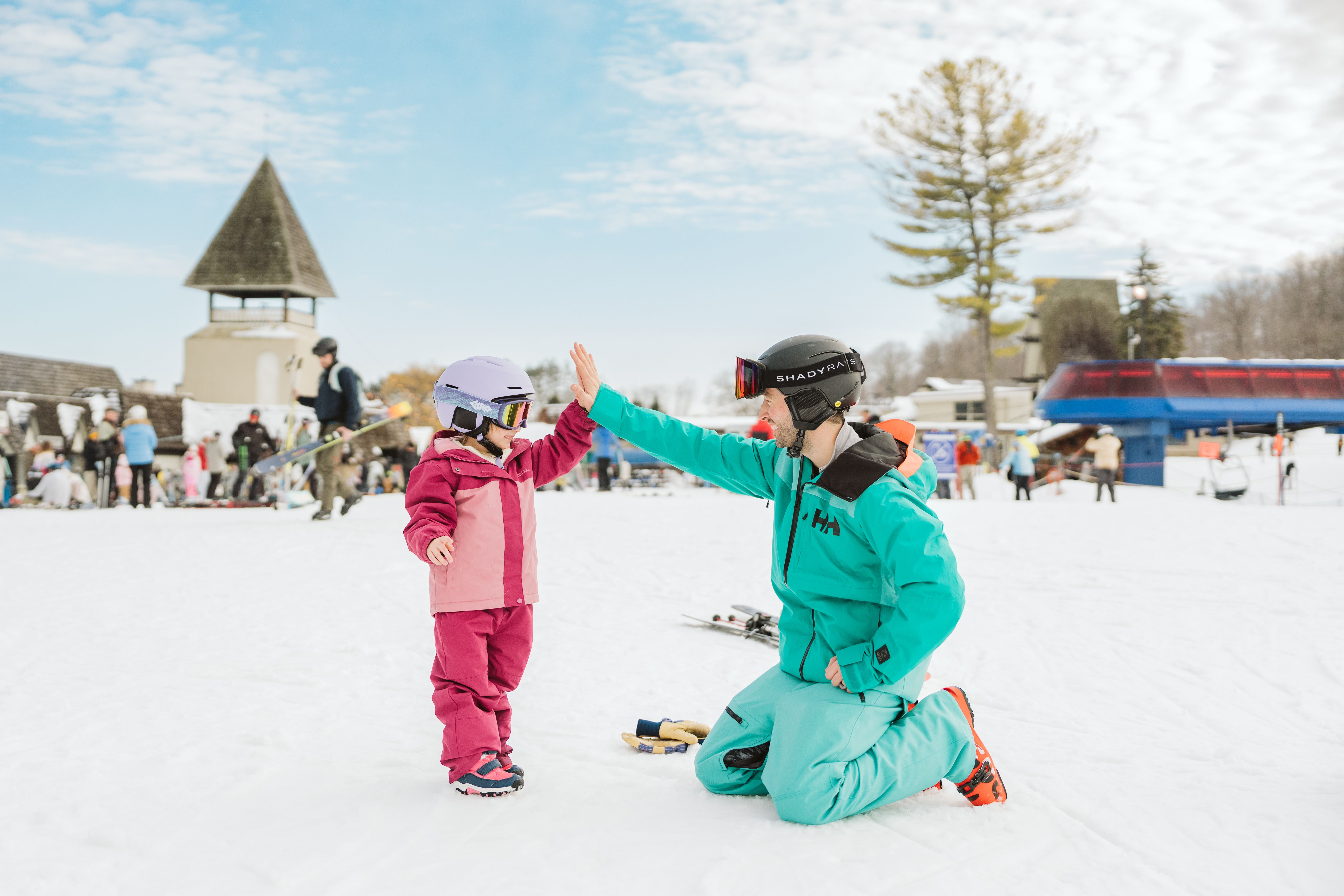 Little boy ripping down the ski hill