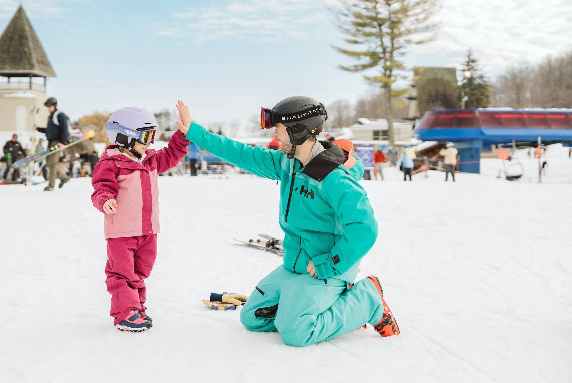 Little boy ripping down the ski hill
