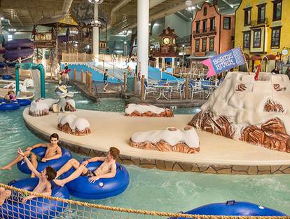 Group of teens floating down the lazy river at Avalanche Bay