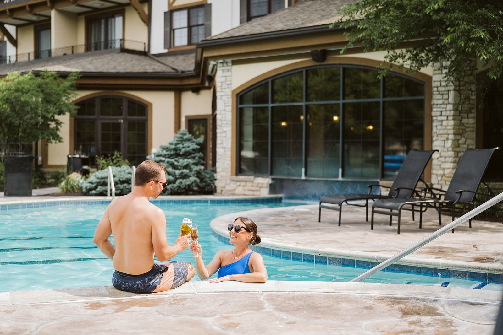 couple celebrating in the pool