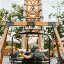 couple sitting on chairlift swing
