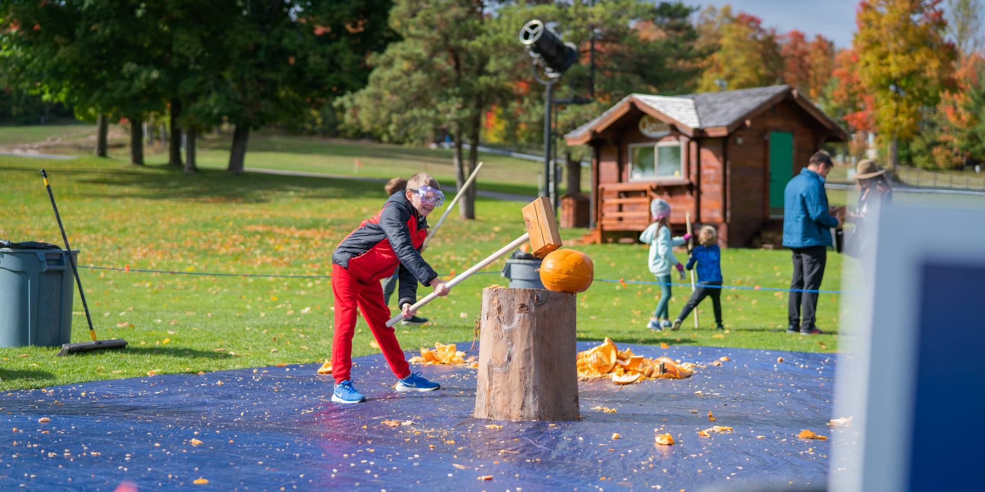 Child smashing pumpkin
