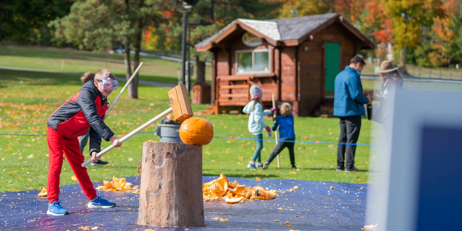 Child smashing pumpkin