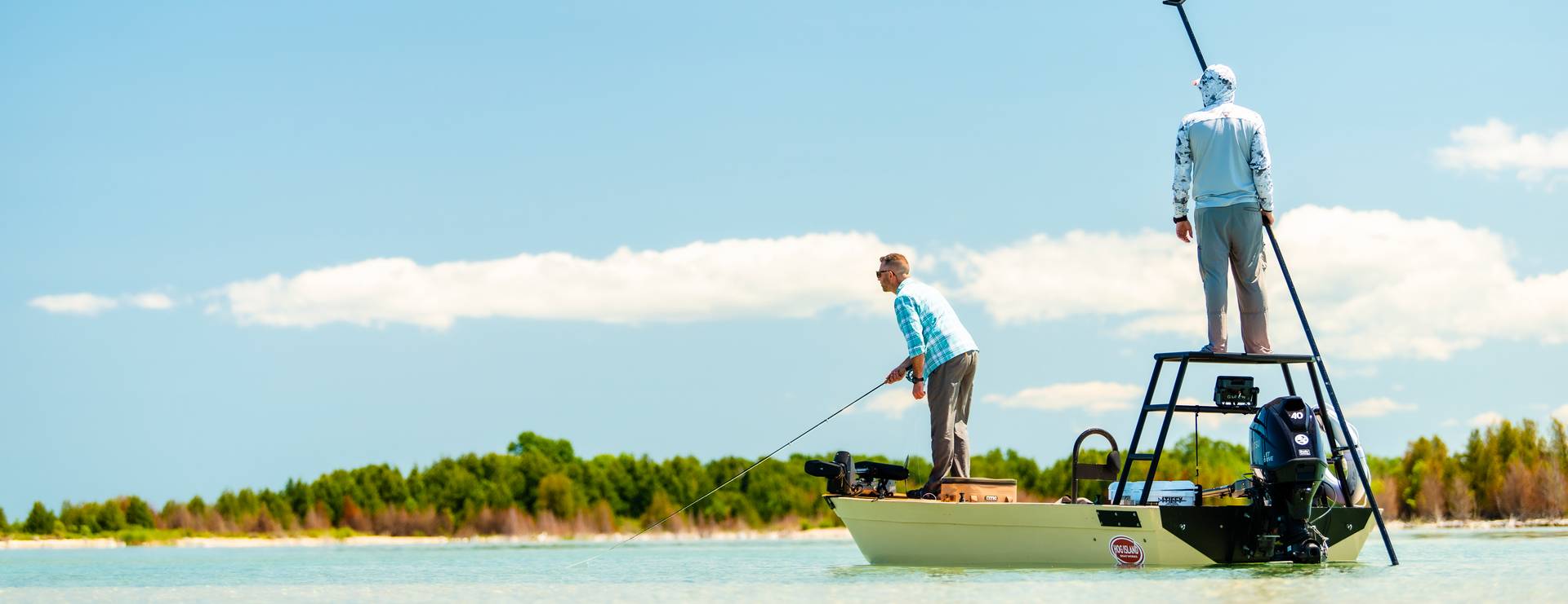 Guys standing on a boat fishing in Sturgeon Bay.
