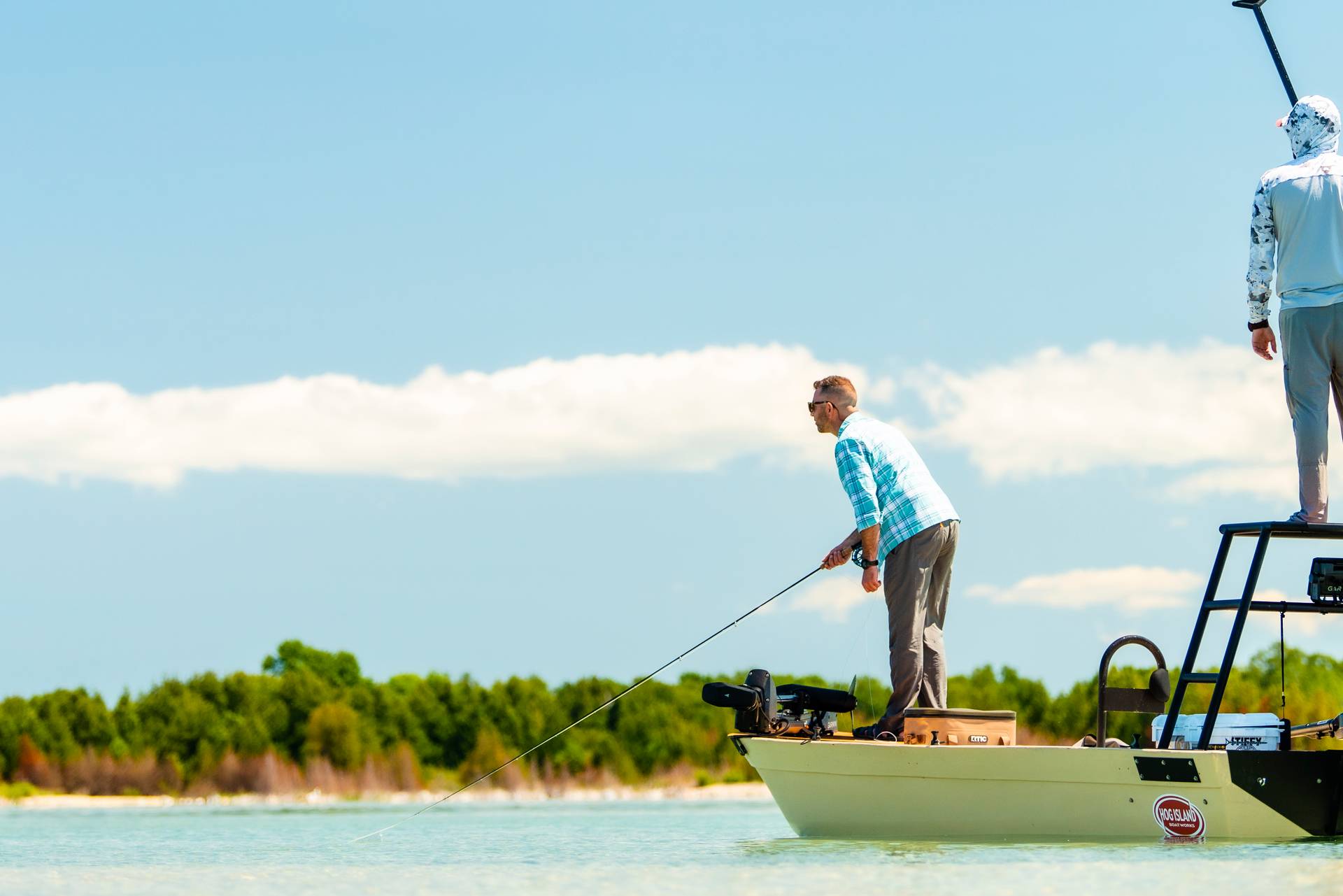 Guys standing on a boat fishing in Sturgeon Bay.