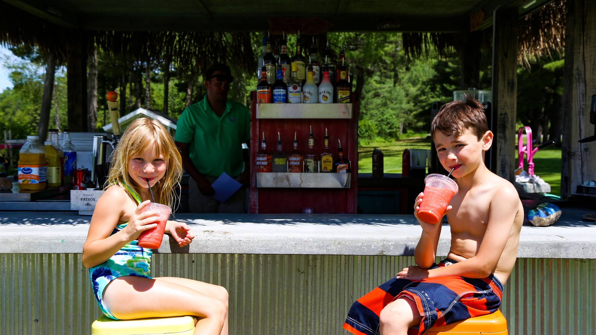 Brother and Sister sitting at GiGI's Tiki Bar