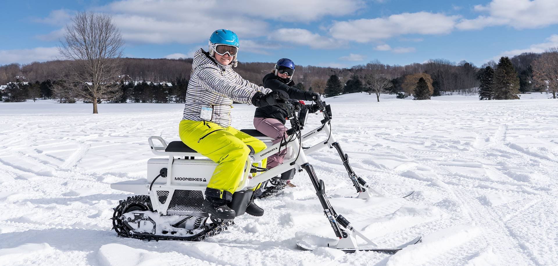 Two ladies riding MoonBikes