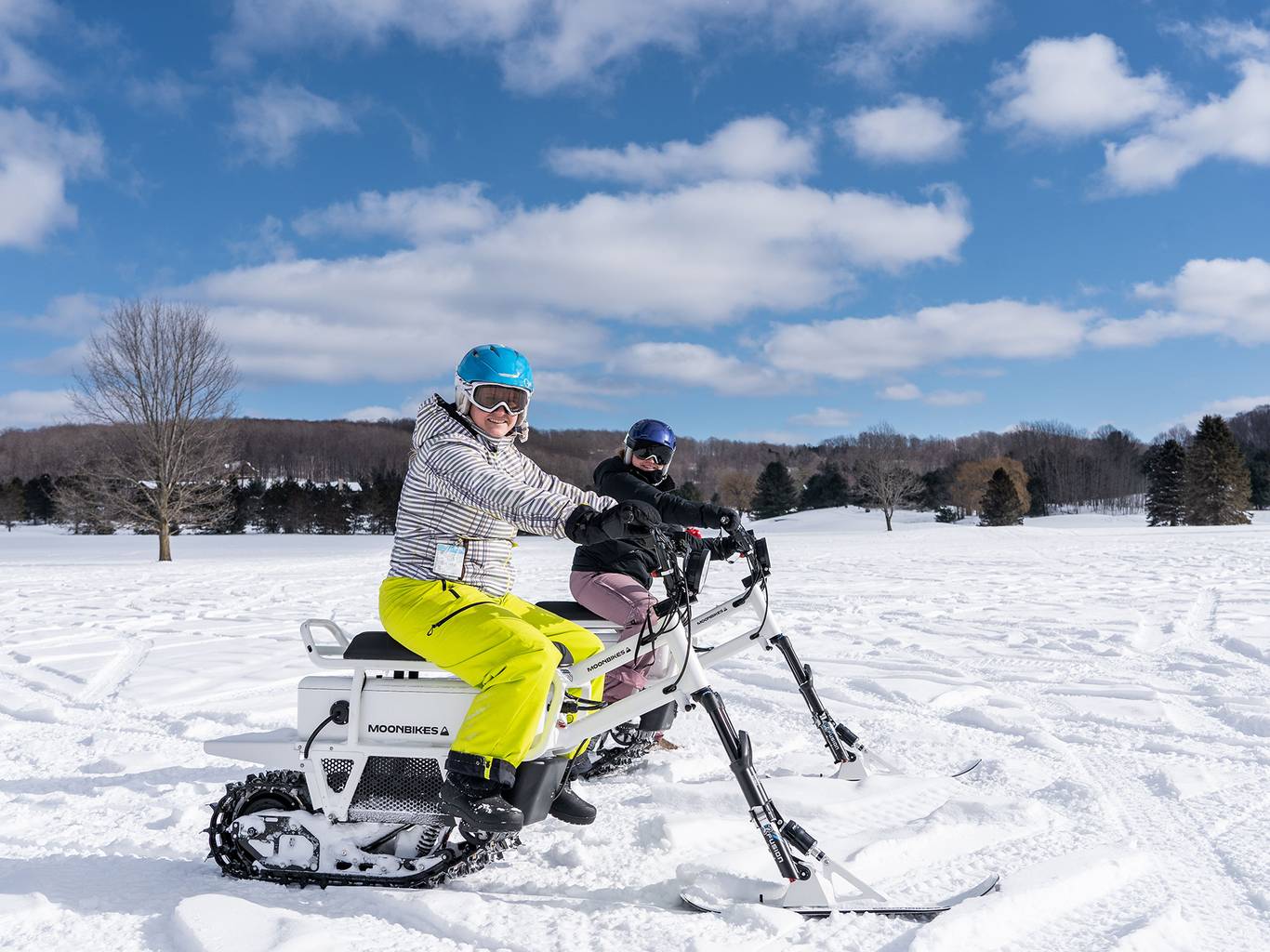 Two people on MoonBikes