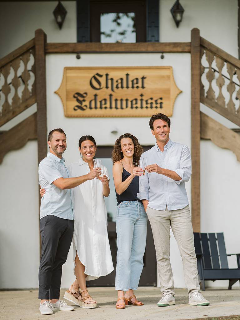 Couples posing outside Chalet Edelweiss