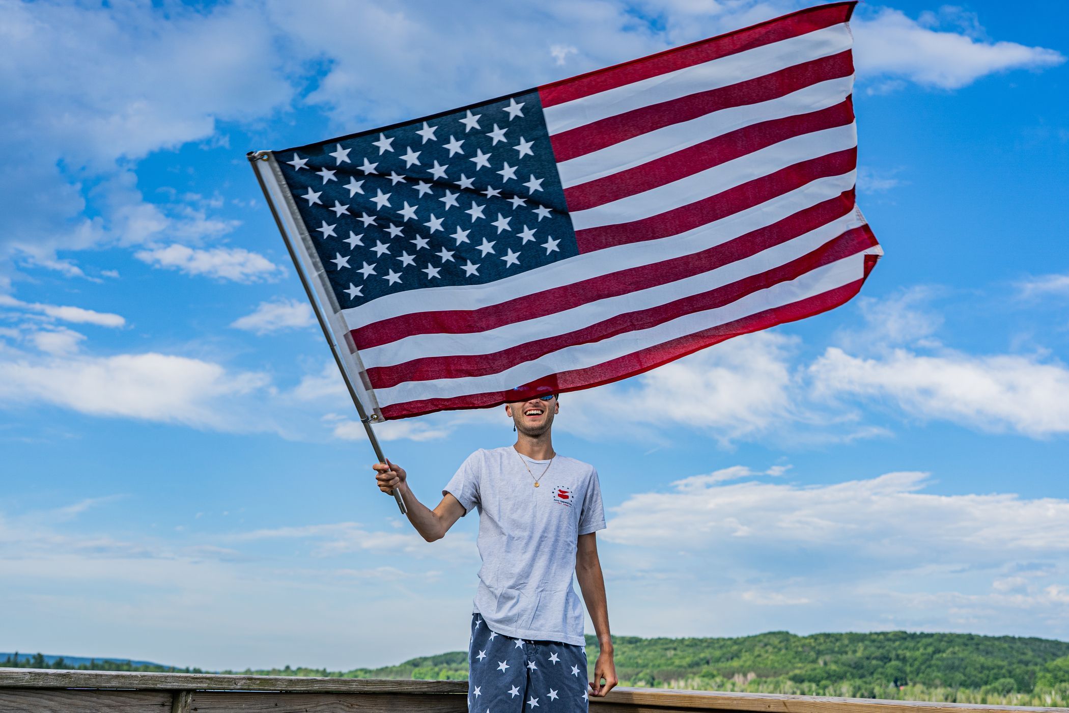 waving the American flag on Deer Lake
