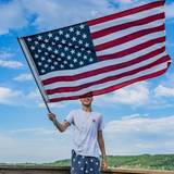 waving the American flag on Deer Lake