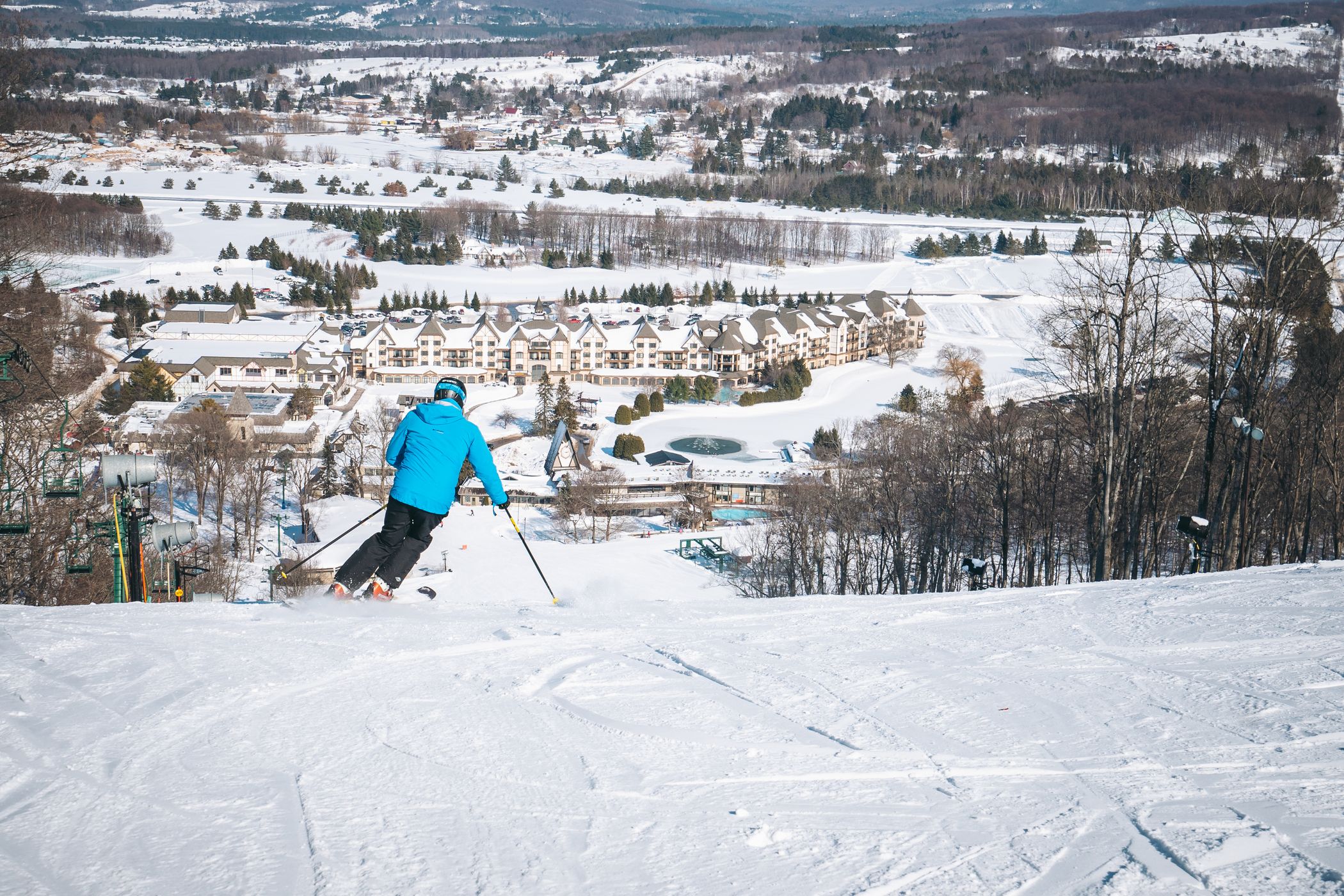 man skiing down hemlock