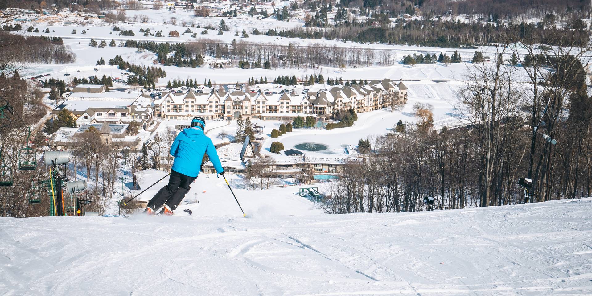 man skiing down hemlock