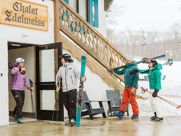 Two couples at Chalet Edelweiss ready to ski