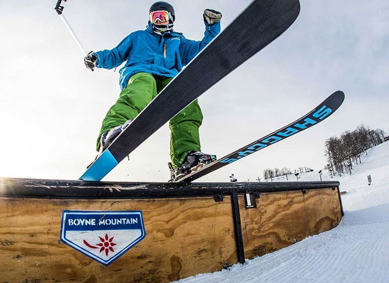 Skier hitting feature on the aurora terrain park