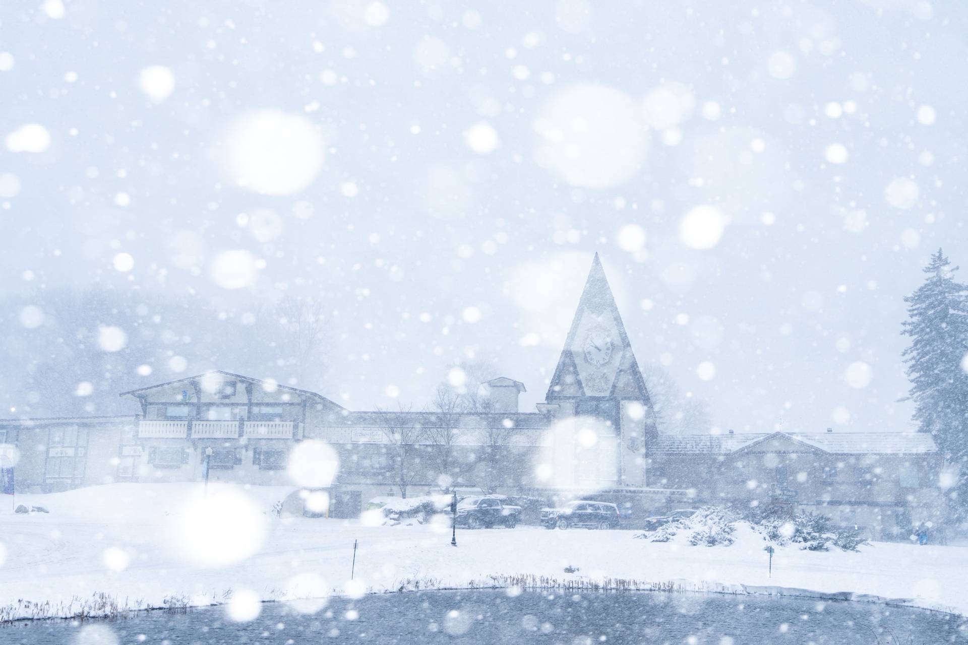 clock tower lodge in a snow storm