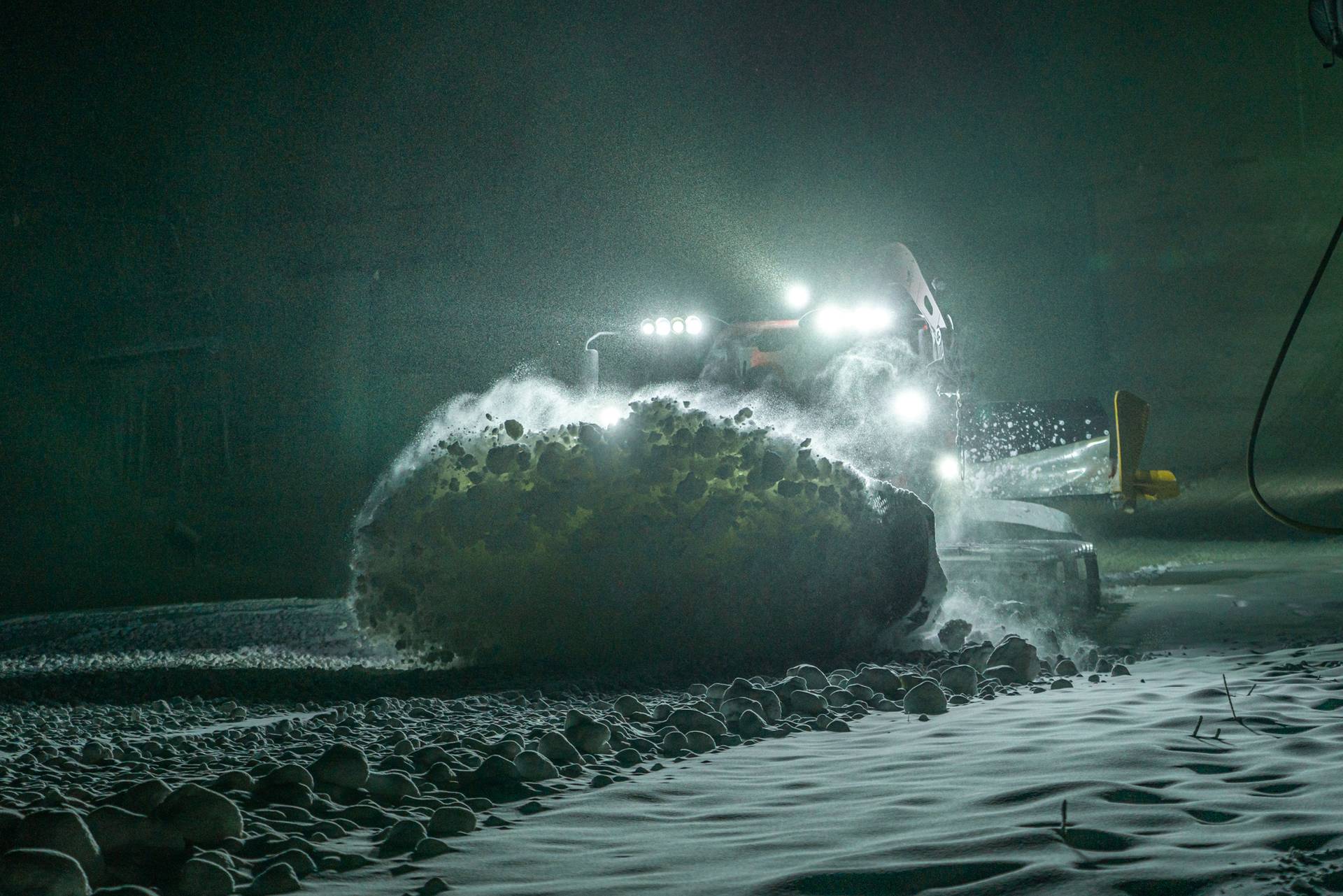 Snowcat grooming mountain