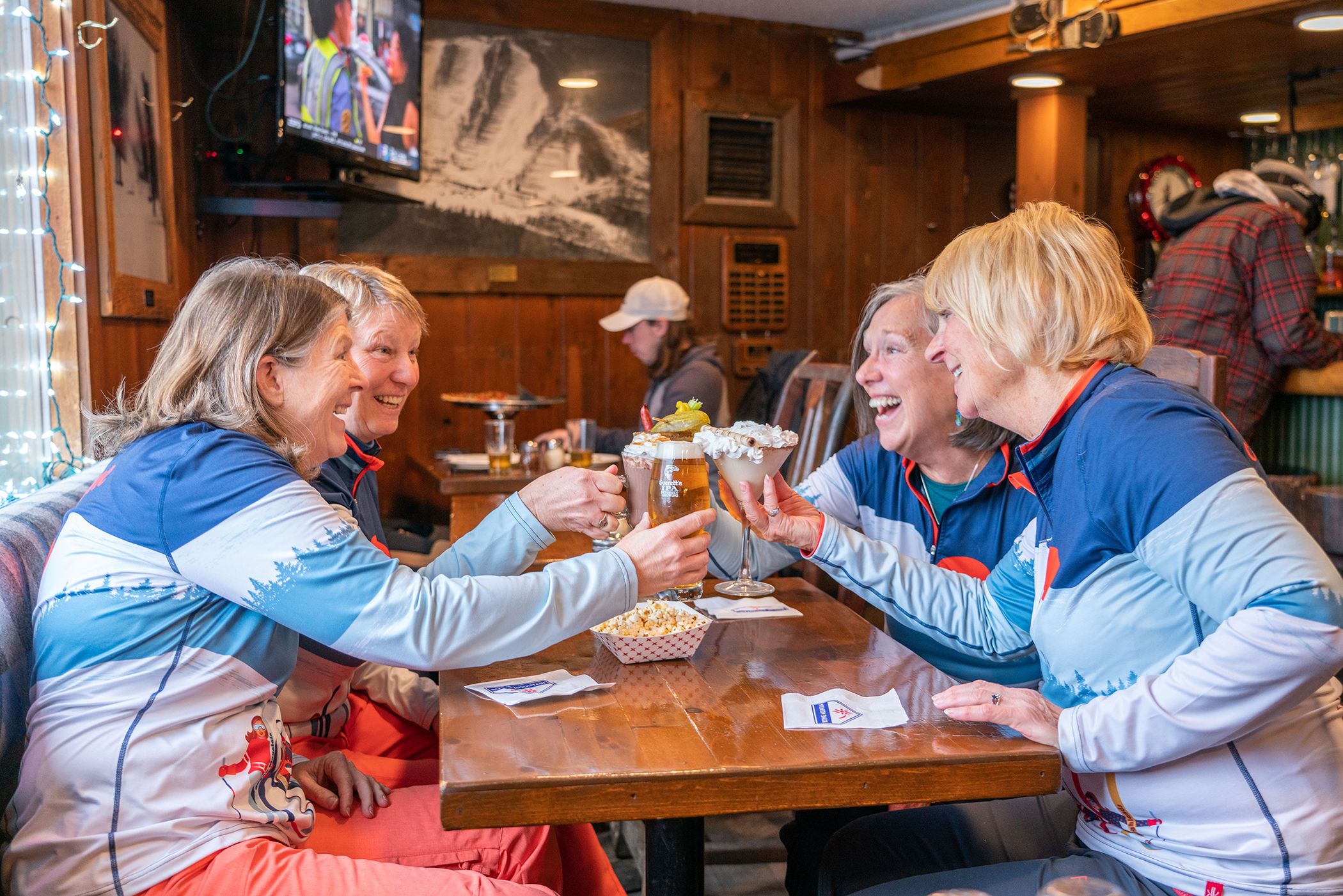 ladies cheersing drinks in the Trophy Room