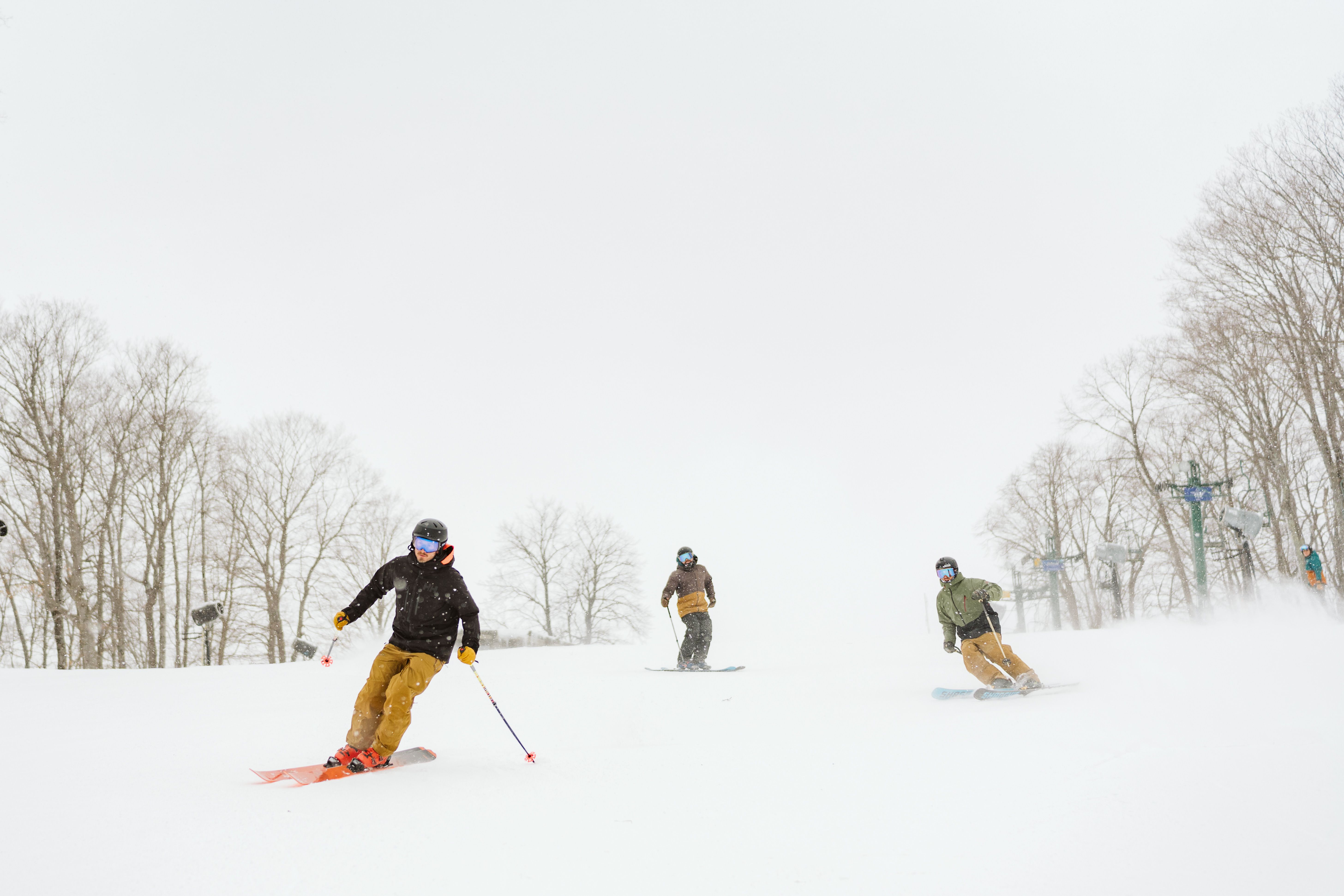 Gree men sking down the slope