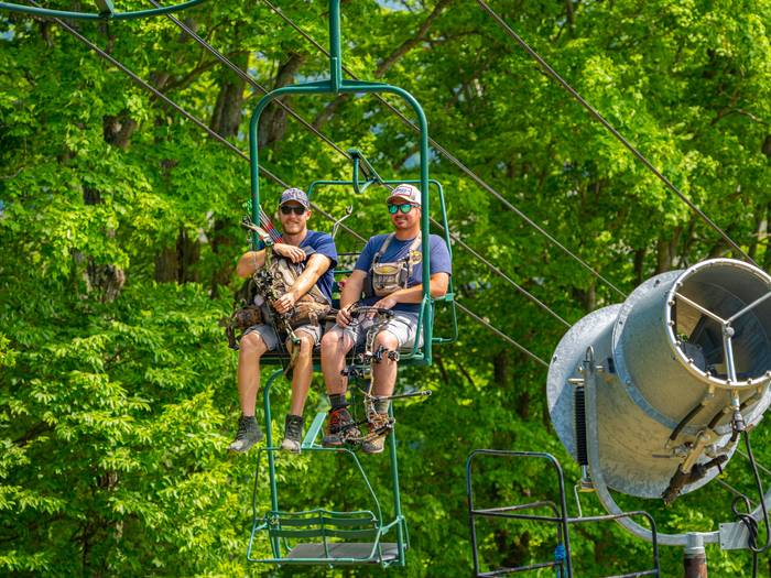 Participants riding up chairlift