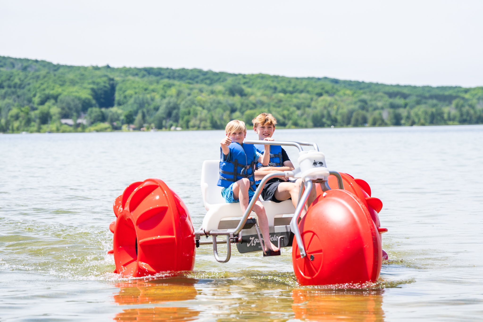 Two boys on a aqua cycle on Deer Lake