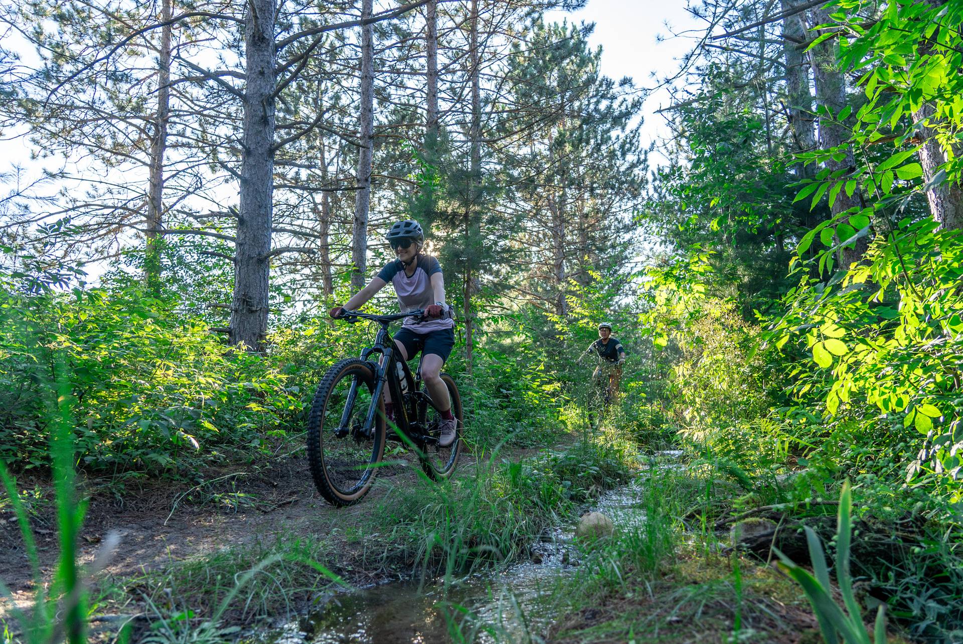 girl biker on cross country trails
