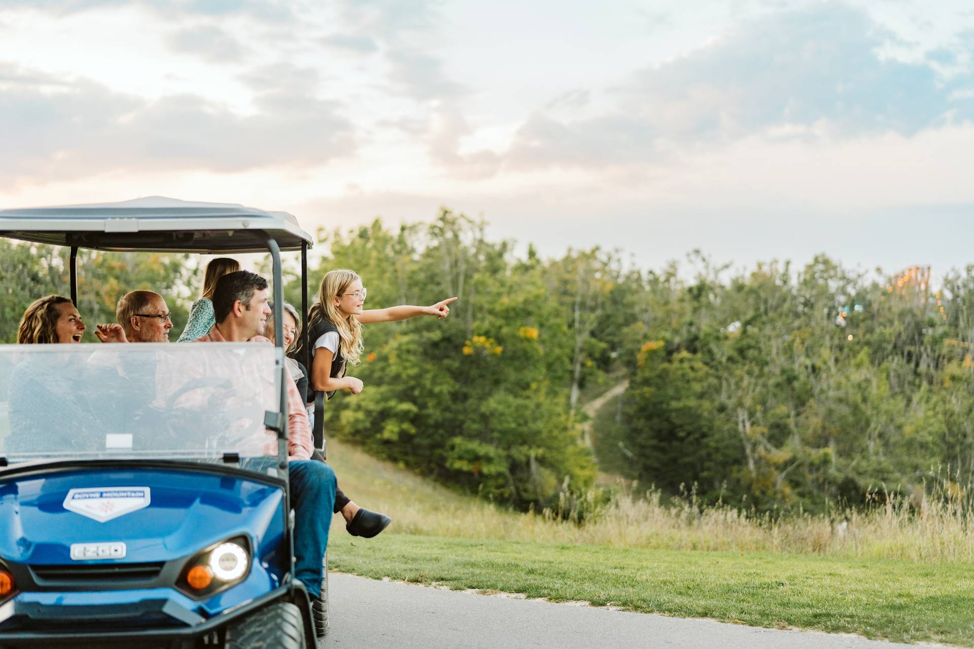 family on scenic cart ride