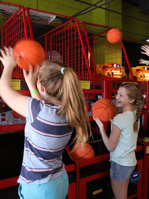 Girls playing basketball in Arcade at Boyne Mountain.