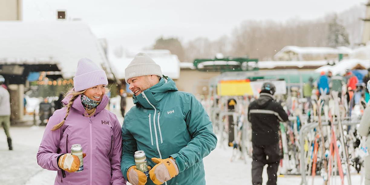 people carrying skis