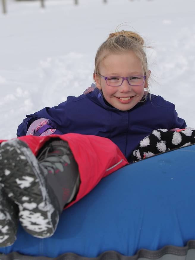 Kid's joined together tubing down
