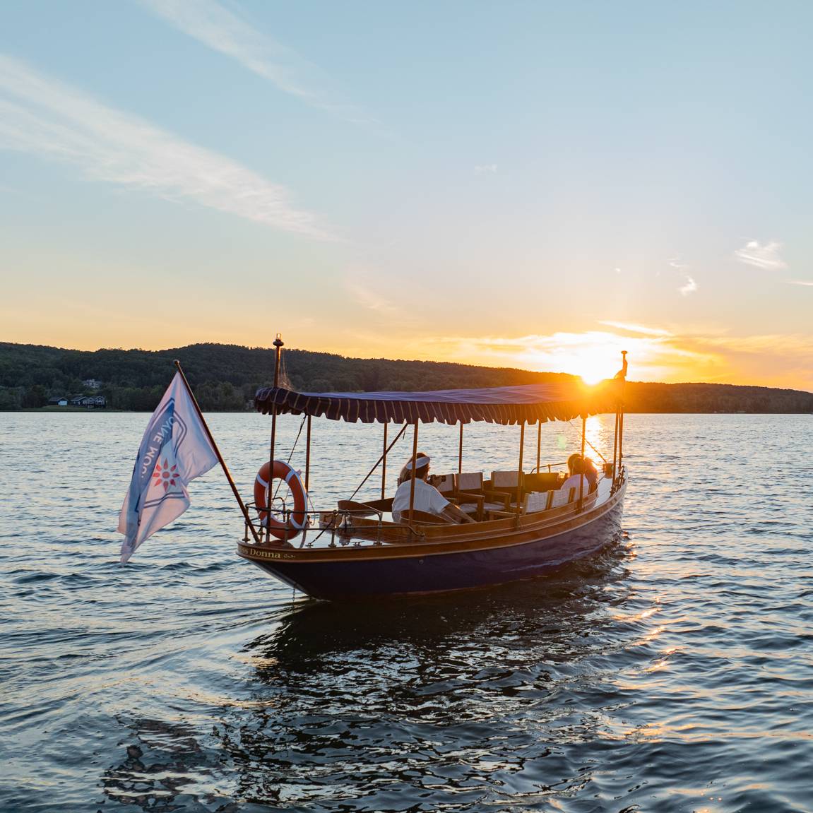 People on a boat cruise on Deer Lake