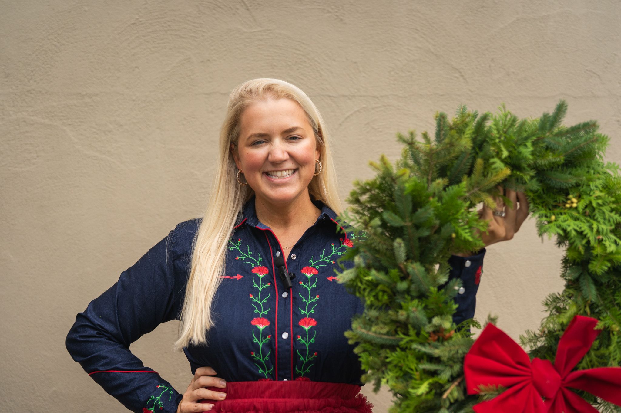 lady holding up wreath