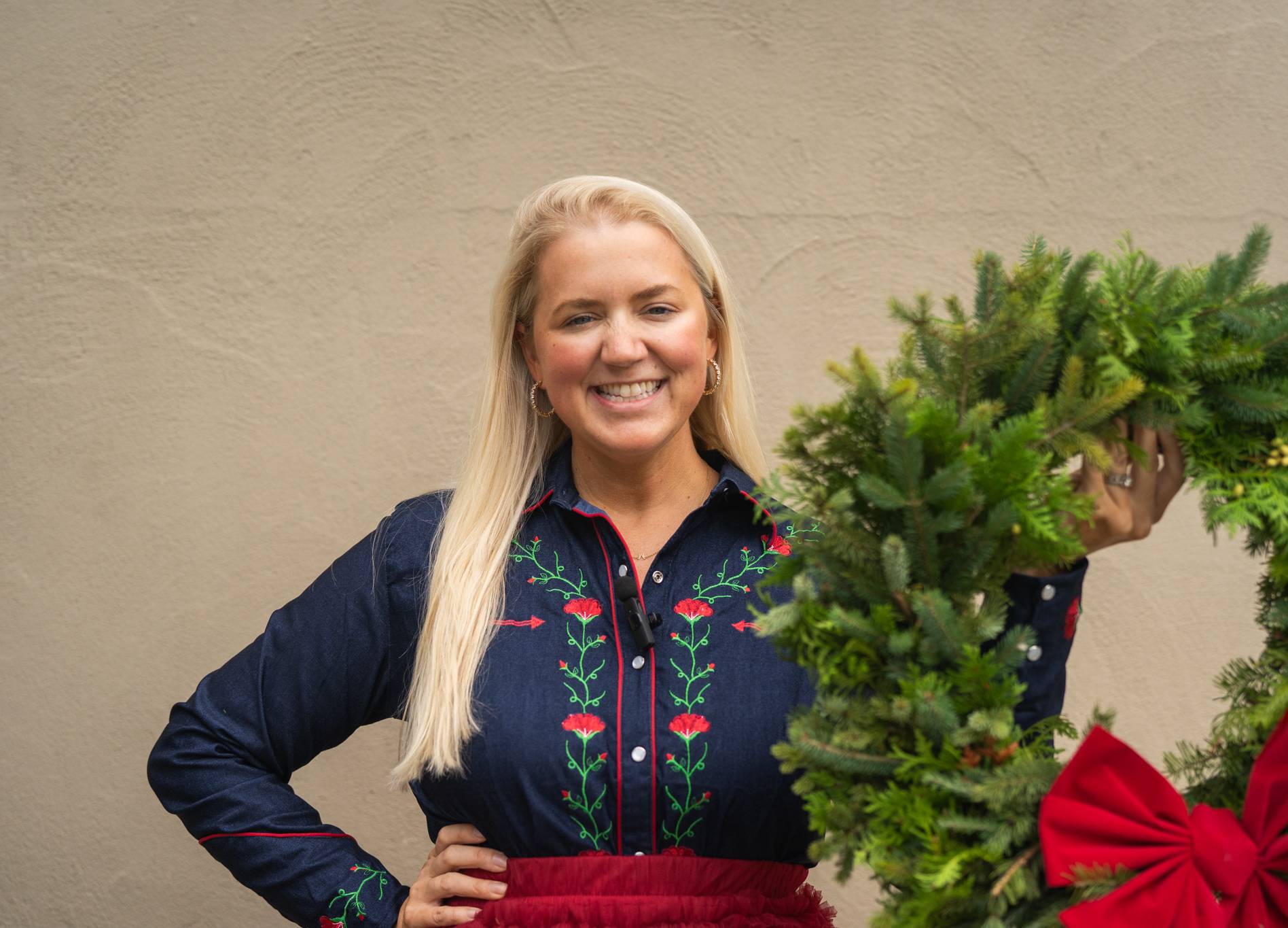 lady holding up wreath