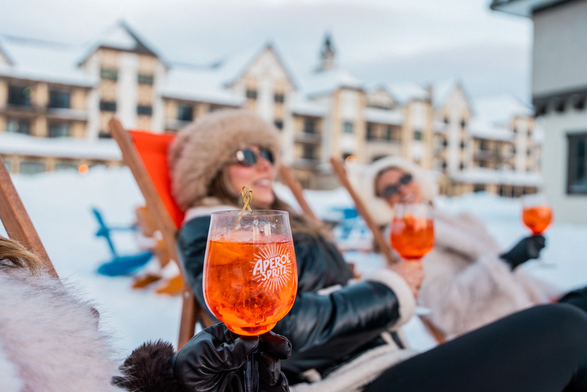 Ladies relaxing with Aperol Spritz drinks