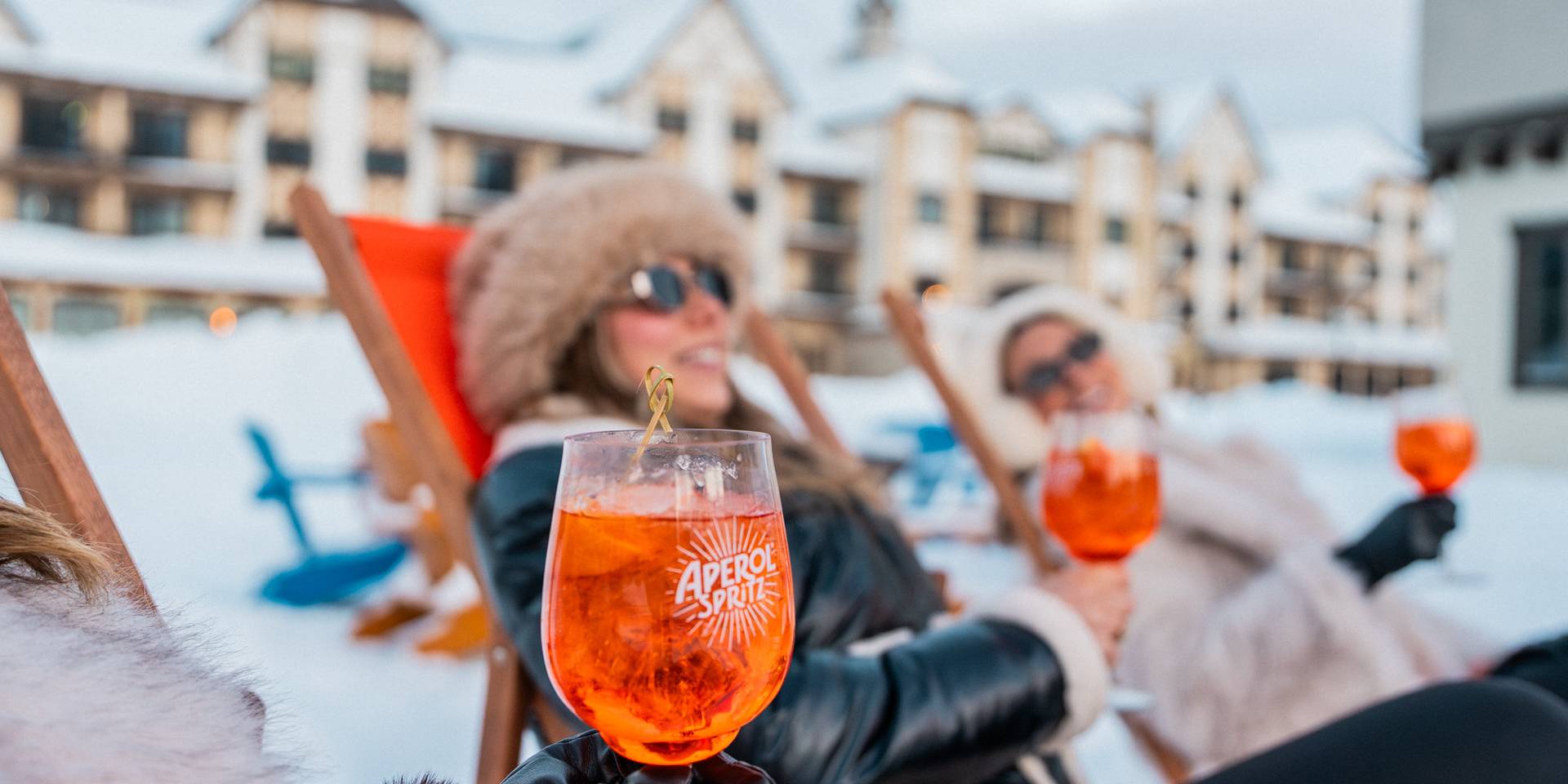 Ladies relaxing with Aperol Spritz drinks