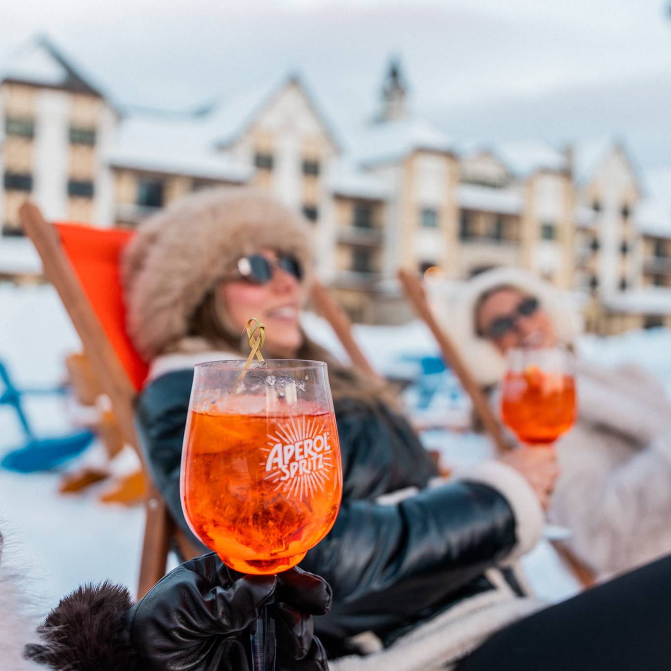 Ladies relaxing with Aperol Spritz drinks