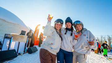 skiers having drinks at iglu
