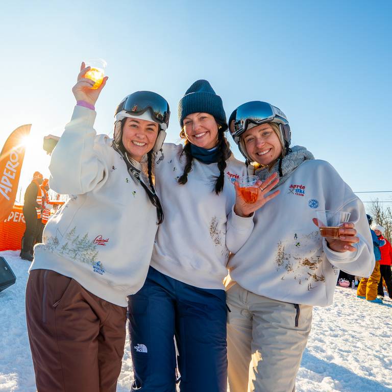 girls holding aperol spritz