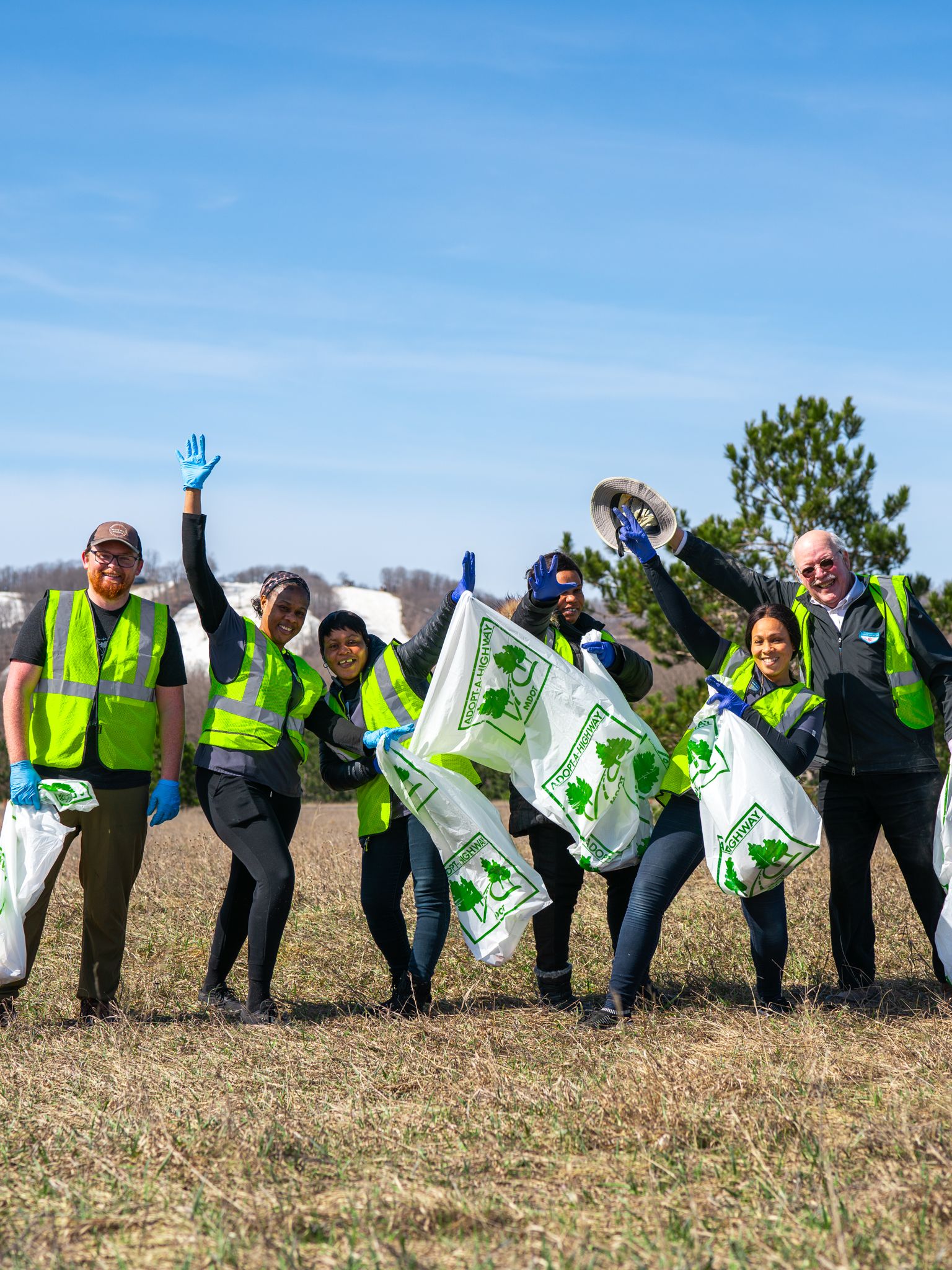 Crews cleaning up the side of the road on highway cleanup day