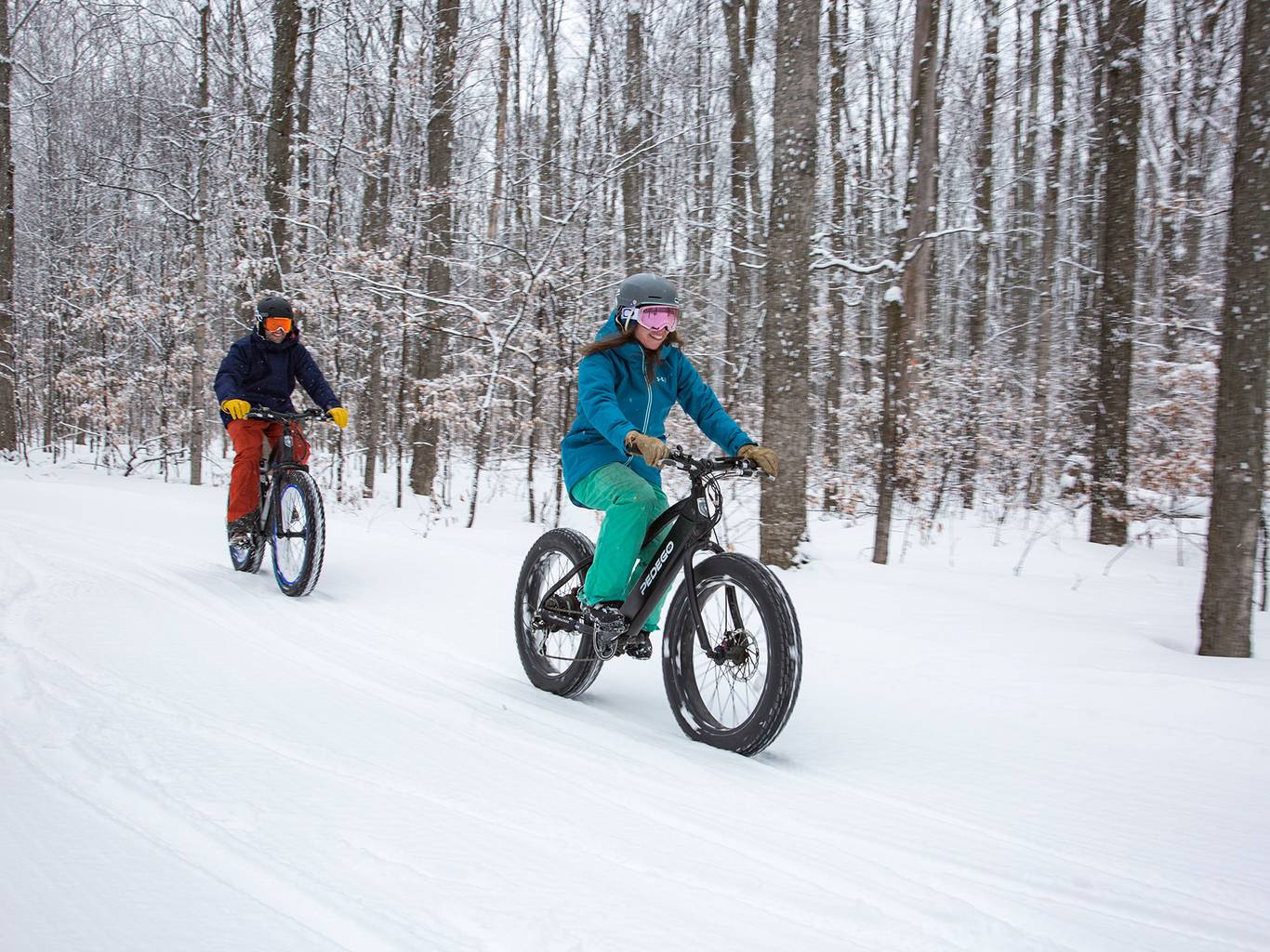Couple on fat tire bikes in the snow