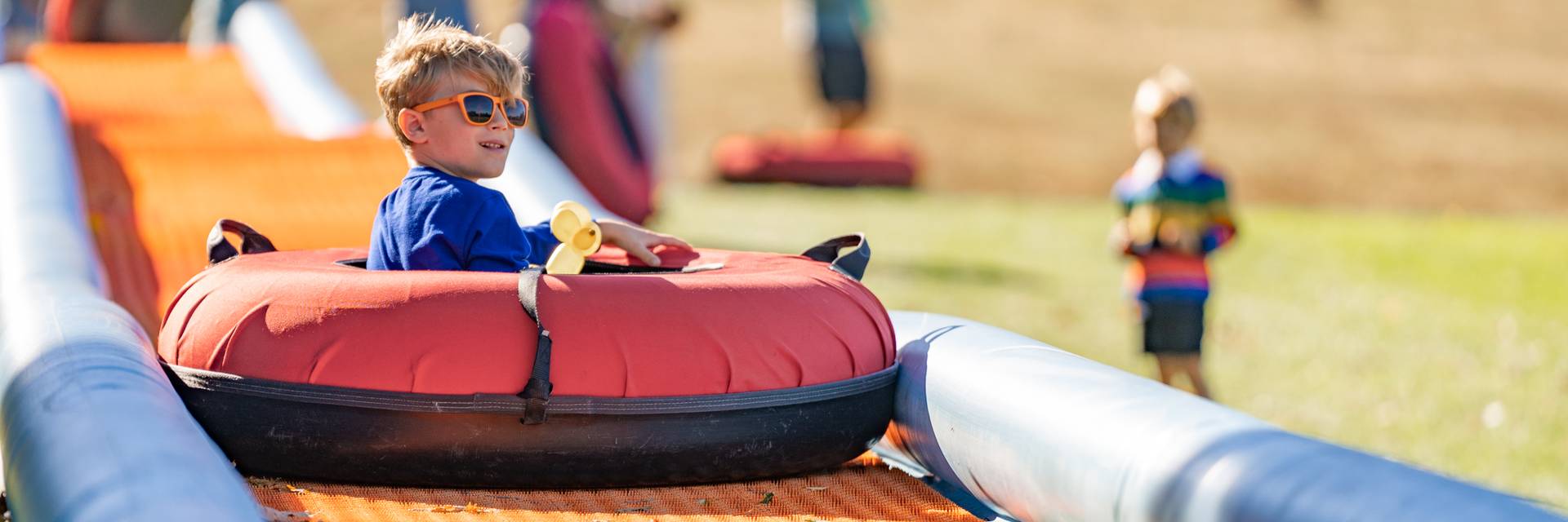child riding tube