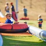 child riding tube
