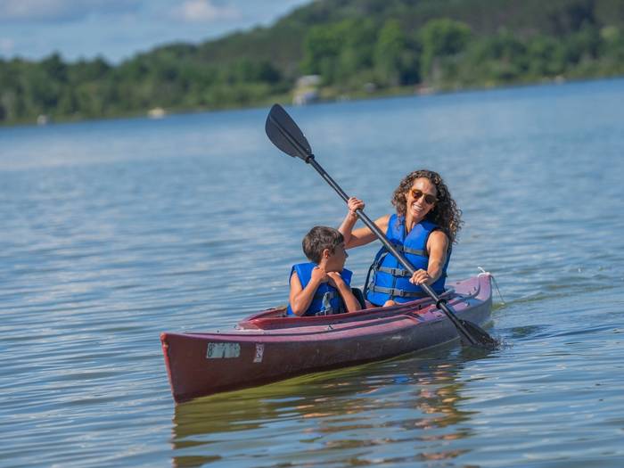mother and son kayaking on deer lake
