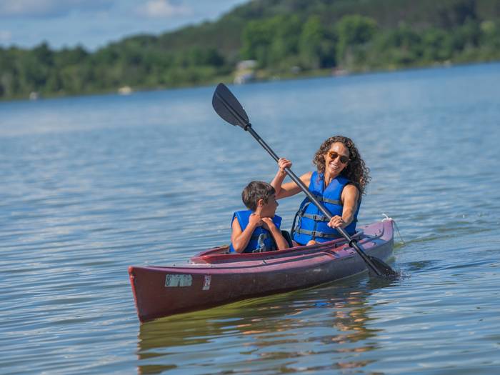 mother and son kayaking on deer lake