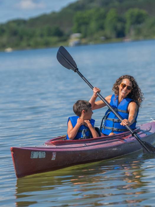 mother and son kayaking on deer lake