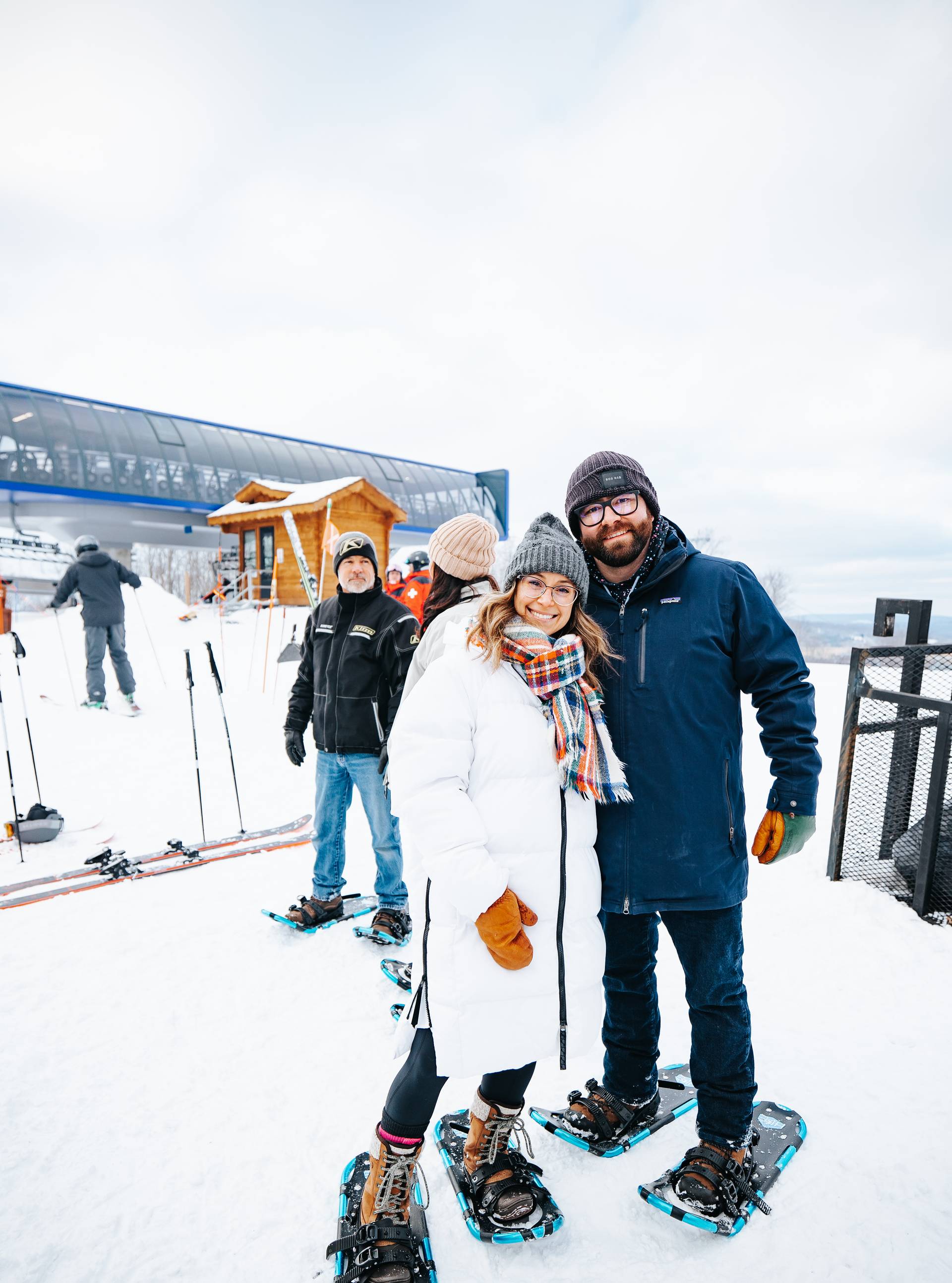 Couple SnowShoeing holding hands