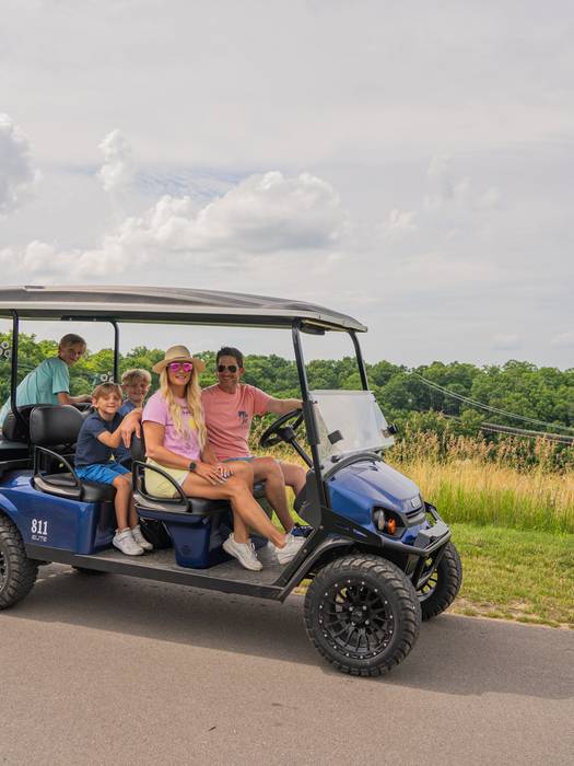 family on scenic cart