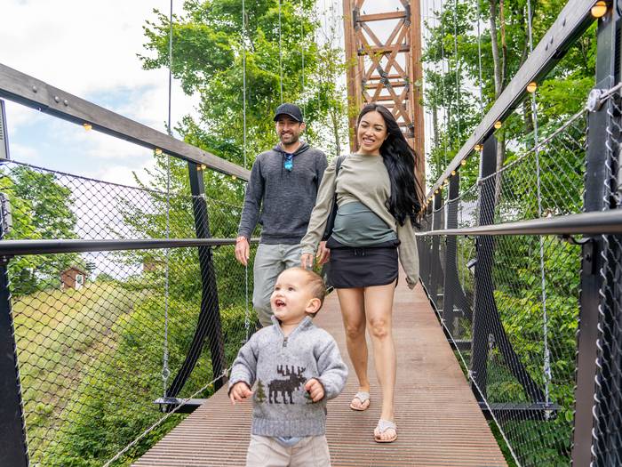 young family on skybridge